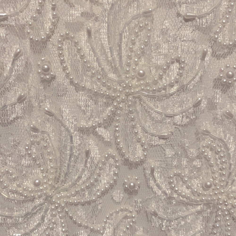 Vintage Wedding gown in silk beaded all over it.